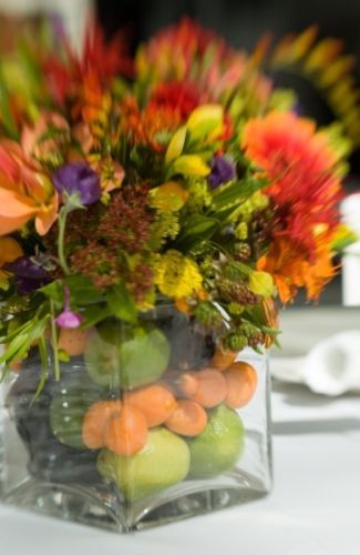 bright arrangement in vase filled with fruit, Montgomery Park, Françoise Weeks