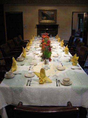 flower garland for head table; bright flowers in wheatgrass, Lewis&Clark College, Françoise Weeks
