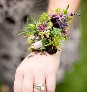 wrist corsage purple blossoms, berries, herbs